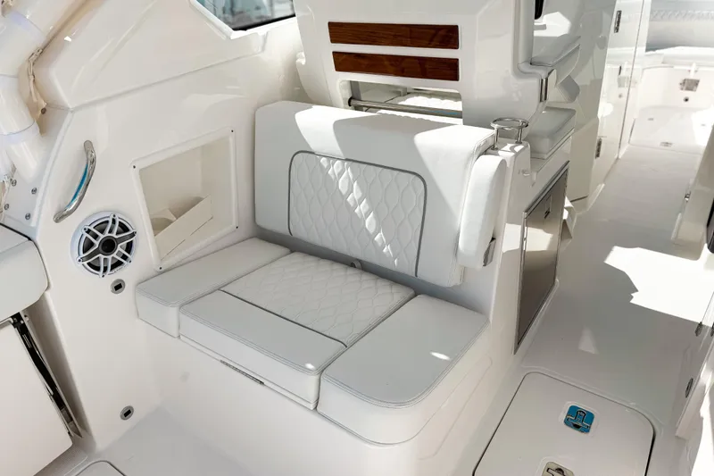 Slide: The Image of 2026 Pursuit DC 306 Dual Console interior with white seating and modern amenities. - 5