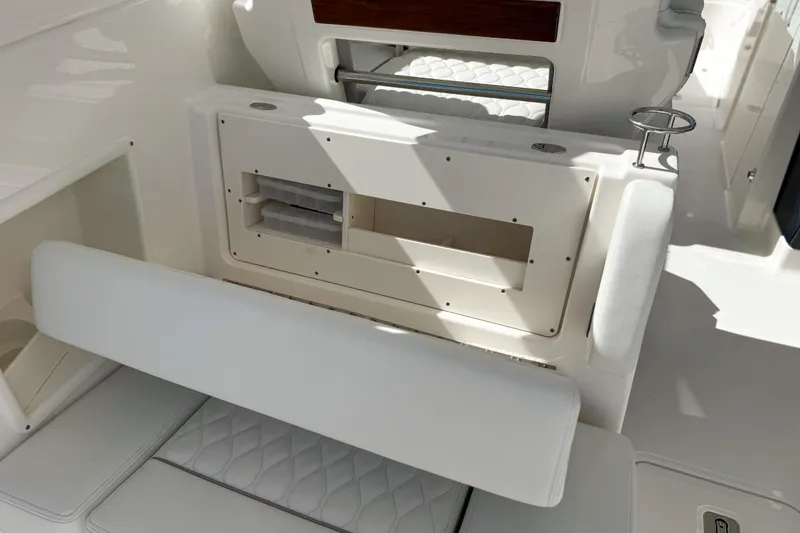 Slide: The Image of 2026 Pursuit DC 306 Dual Console interior seating and storage detail. - 7