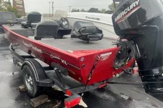 Slide: The Image of 2023 Tracker Bass Tracker Classic XL boat with Mercury engine on trailer. - 4