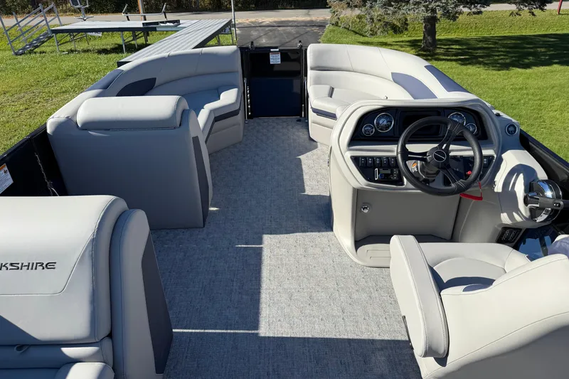 Slide: The Image of 2026 Berkshire 22 CL2 LE pontoon boat interior with modern helm and plush seating. - 7