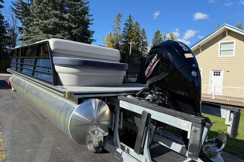 Slide: The Image of 2026 Berkshire 22 CL2 LE pontoon boat with Mercury outboard motor on trailer. - 9
