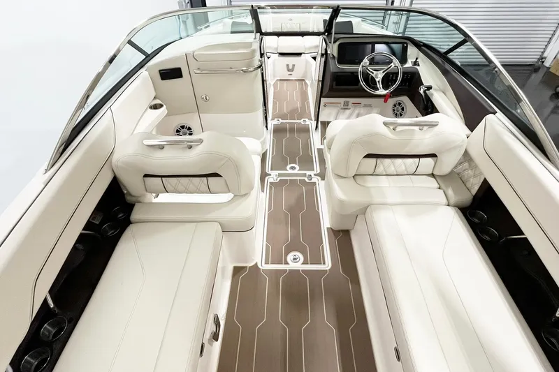 Slide: The Image of 2025 Regal LX6 boat interior with luxurious white seating and modern dashboard design. - 7
