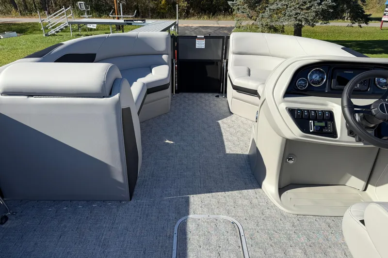 Slide: The Image of 2026 Berkshire 22 RFX LE pontoon boat interior with plush seating and modern dashboard. - 11