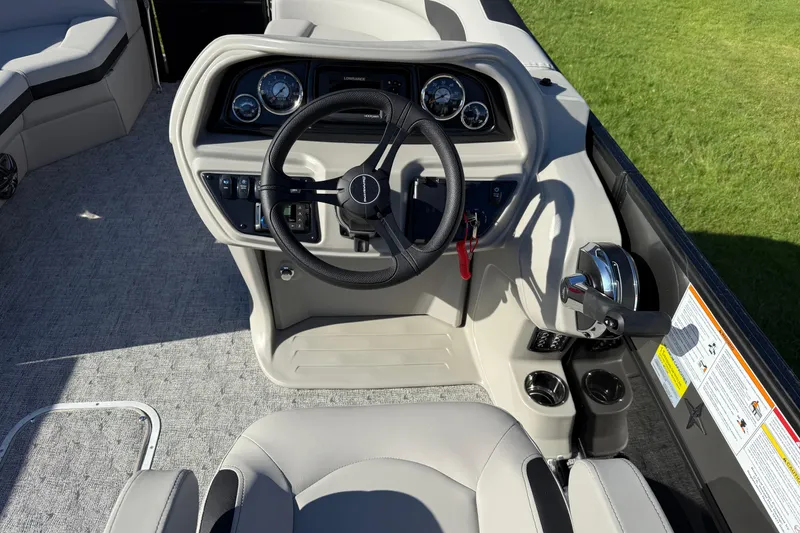 Slide: The Image of 2026 Berkshire 22 RFX LE boat dashboard with steering wheel and controls. - 14