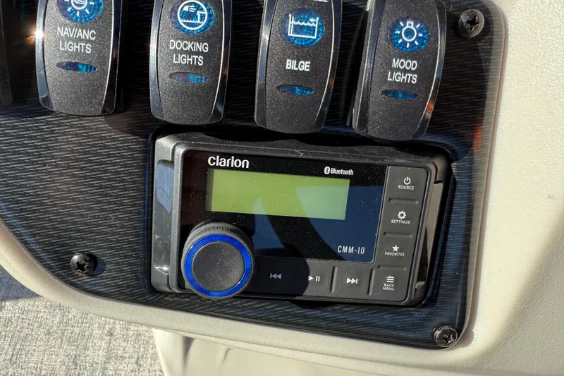 Slide: The Image of Control panel of 2026 Berkshire 22 RFX LE with Clarion audio system and light switches. - 15