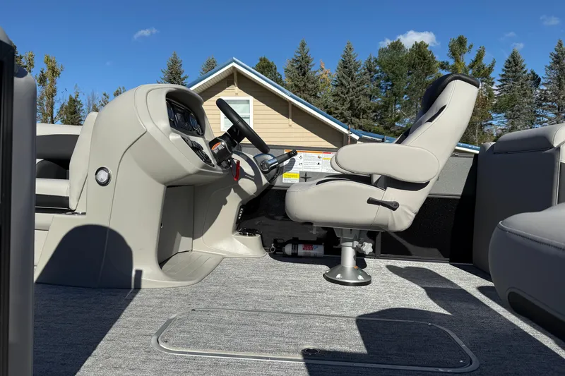 Slide: The Image of 2026 Berkshire 22 RFX LE boat interior with captain's chair and control panel. - 3