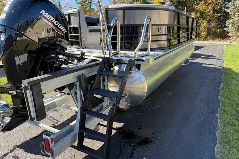 Slide: The Image of 2026 Berkshire 22 RFX LE pontoon boat with Mercury engine on a trailer. - 5