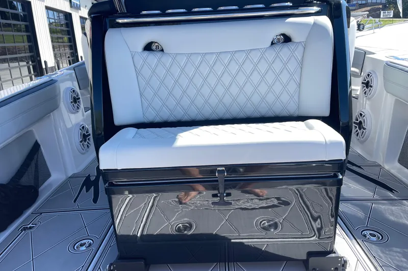 Slide: The Image of 2026 Nor-Tech 340 Sport Center Console with luxurious white seating and sleek design. - 10