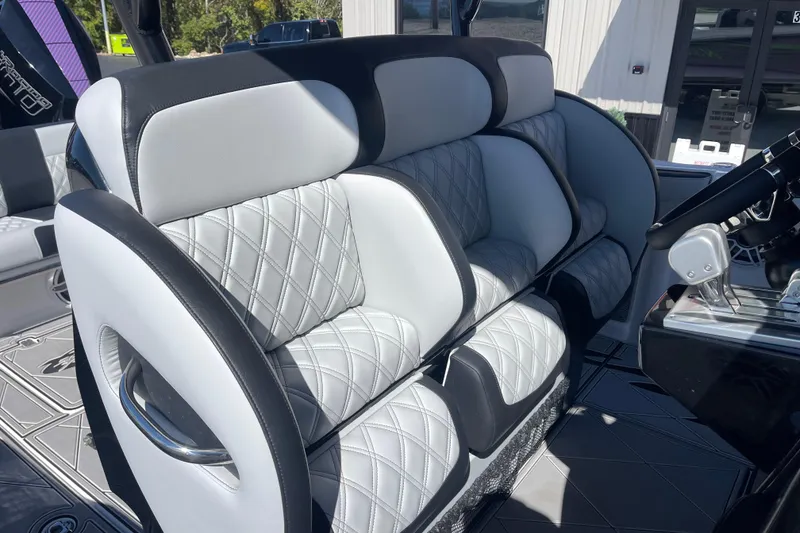 Slide: The Image of 2026 Nor-Tech 340 Sport Center Console with luxurious quilted seating and modern design. - 13