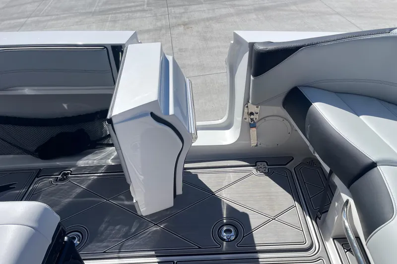 Slide: The Image of 2026 Nor-Tech 340 Sport Center Console interior with sleek seating and modern flooring design. - 9