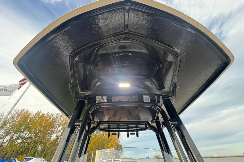 Slide: The Image of 2024 Robalo R230 Center Console boat T-top with LED lights, viewed from below. - 10