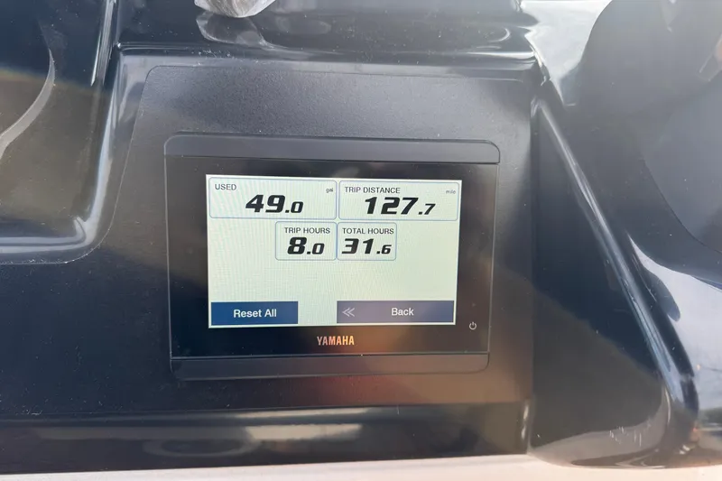 Slide: The Image of Yamaha display on 2024 Robalo R230 Center Console showing fuel and trip data. - 18