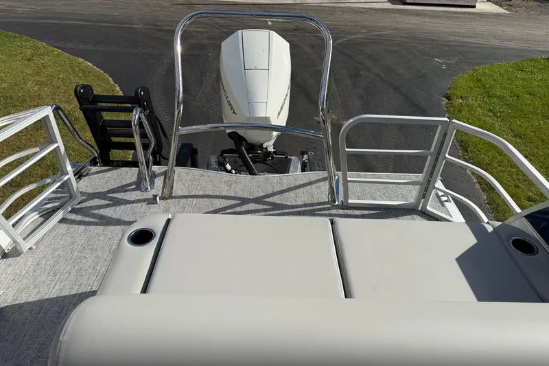 Slide: The Image of 2026 Berkshire 24 UL LE pontoon boat with outboard motor and seating area. - 11