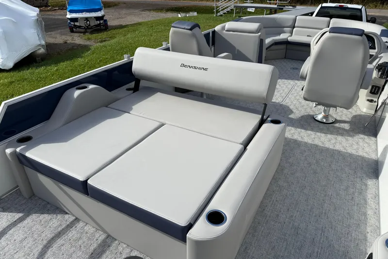 Slide: The Image of 2026 Berkshire 24 UL LE pontoon boat interior with plush seating and modern design. - 7