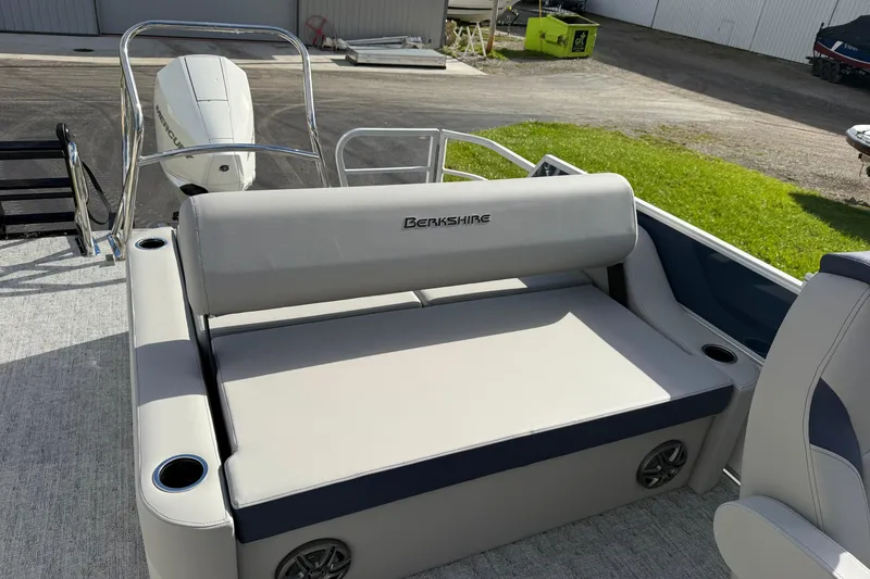 Slide: The Image of 2026 Berkshire 24 UL LE pontoon boat interior with seating and cup holders. - 8