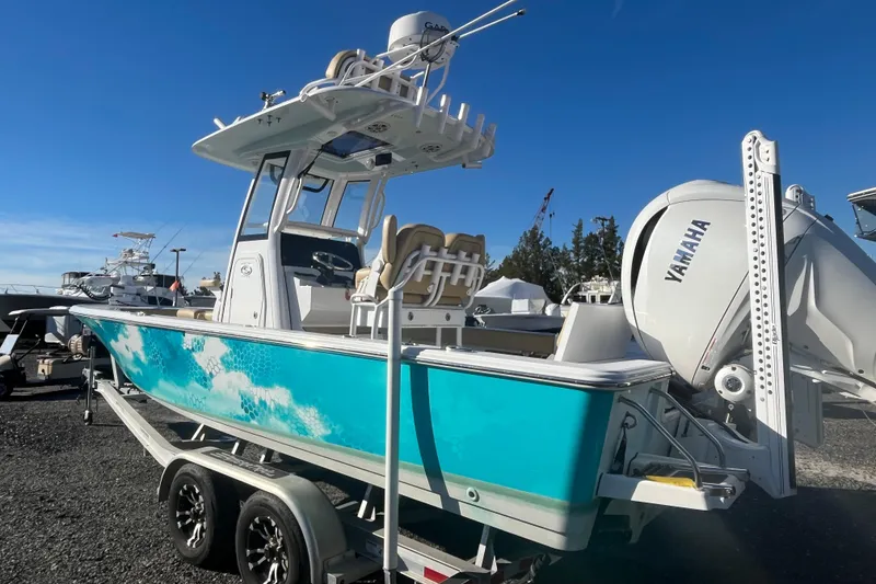 Slide: The Image of 2024 Sportsman Masters 247OE Bay Boat with Yamaha engine on trailer. - 12