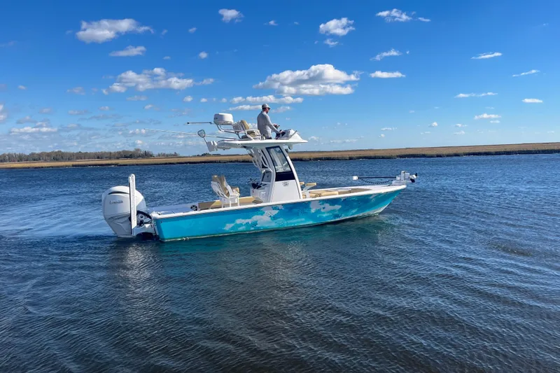 Slide: The Image of 2024 Sportsman Masters 247OE Bay Boat cruising on a sunny day. - 4