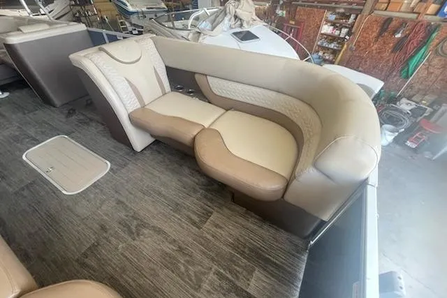 Slide: The Image of Luxurious seating on 2020 MONACO 235C boat, featuring beige and cream upholstery. - 6