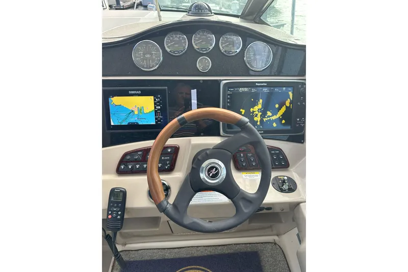 Slide: The Image of 2008 Sea Ray 290 Sundancer helm with navigation displays and gauges. - 10