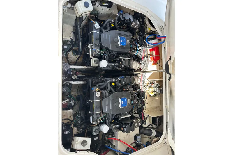 Slide: The Image of Engine compartment of 2008 Sea Ray 290 Sundancer with dual engines and wiring. - 20