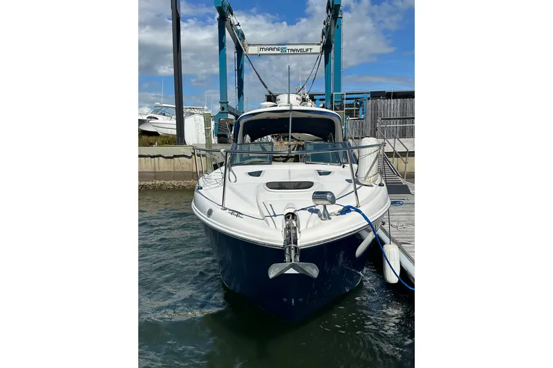 Slide: The Image of 2008 Sea Ray 290 Sundancer docked at marina with blue sky background. - 3