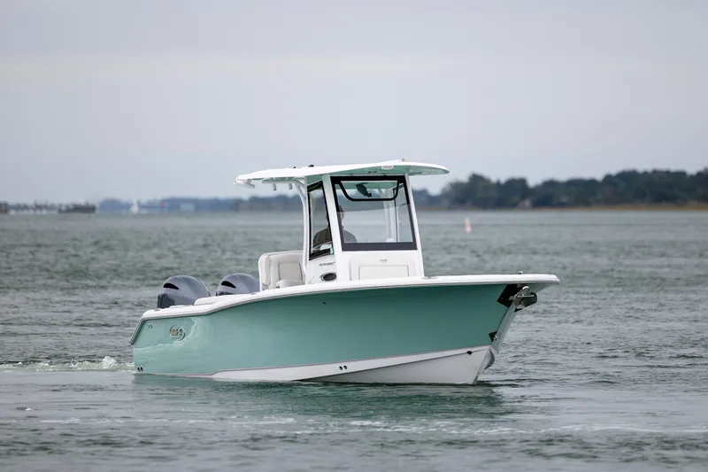 Slide: The Image of 2023 Sea Hunt Ultra 265 SE boat cruising on open water. - 7
