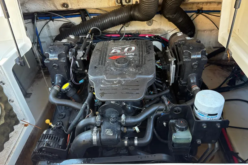 Slide: The Image of Engine compartment of a 2004 Sea Ray 240 Sundeck with MerCruiser 5.0 MPI engine. - 11