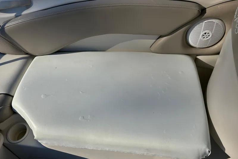 Slide: The Image of 2004 Sea Ray 240 Sundeck boat seat with speaker and cup holder. - 17