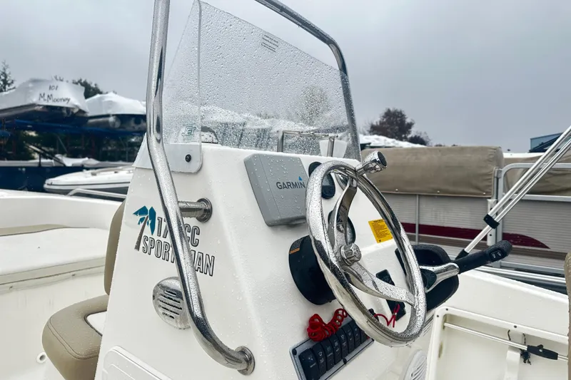 Slide: The Image of 2018 Key West 186 Center Console boat with wet steering wheel and Garmin device. - 3