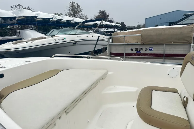 Slide: The Image of 2018 Key West 186 Center Console boat in a marina with other boats. - 4