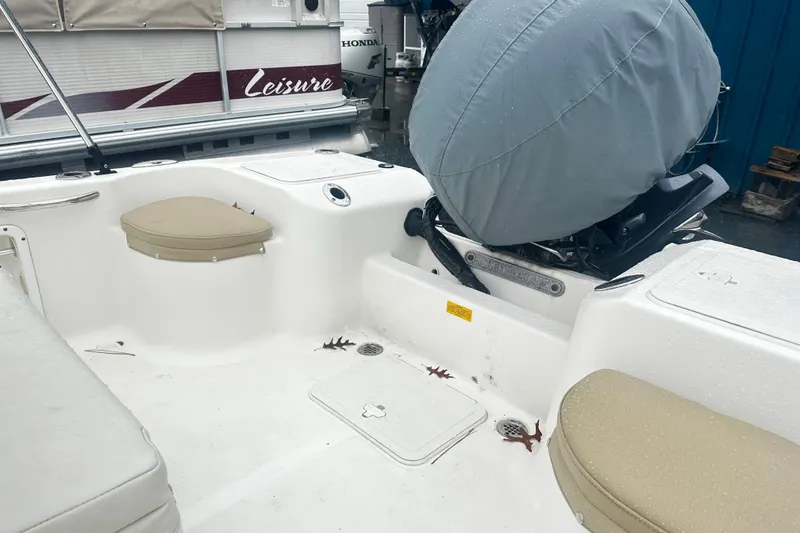 Slide: The Image of 2018 Key West 186 Center Console boat interior with covered engine and seating. - 5
