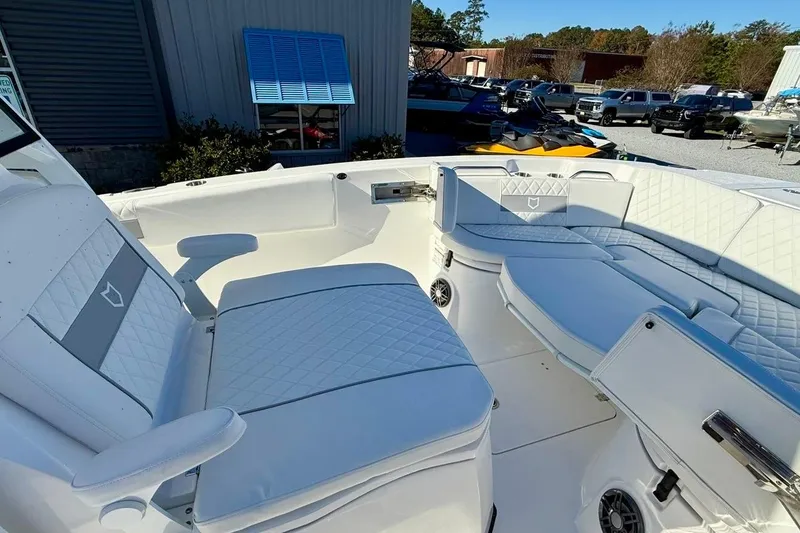 Slide: The Image of 2026 Sea Fox 268 Commander boat interior with white cushioned seating. - 10