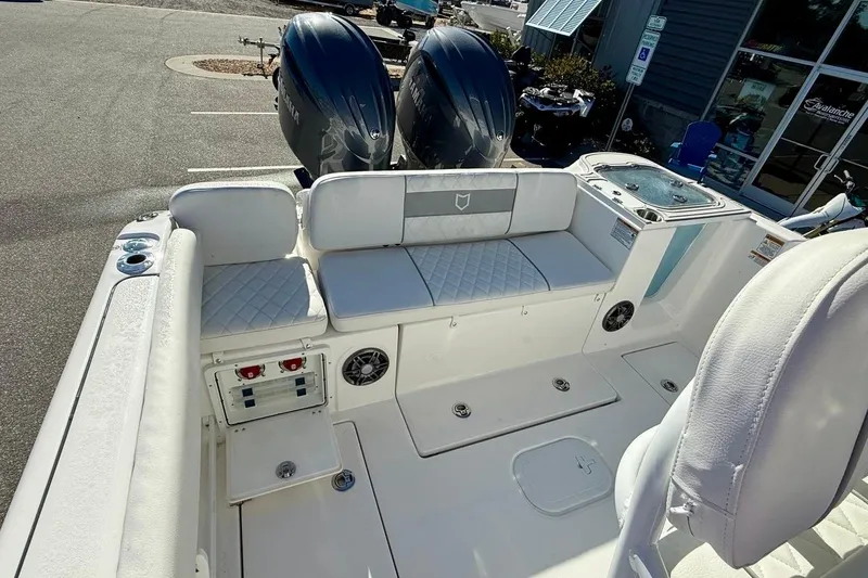Slide: The Image of 2026 Sea Fox 268 Commander boat interior with seating and dual Yamaha engines. - 16