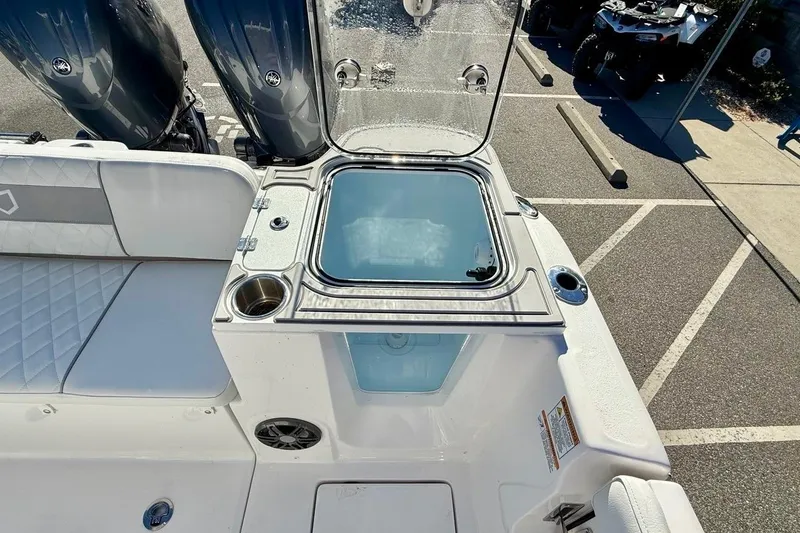 Slide: The Image of 2026 Sea Fox 268 Commander boat interior with open hatch and twin engines. - 17