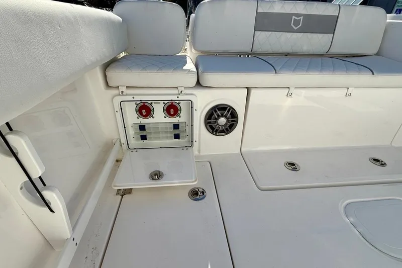 Slide: The Image of 2026 Sea Fox 268 Commander boat interior with seating and control panel. - 18