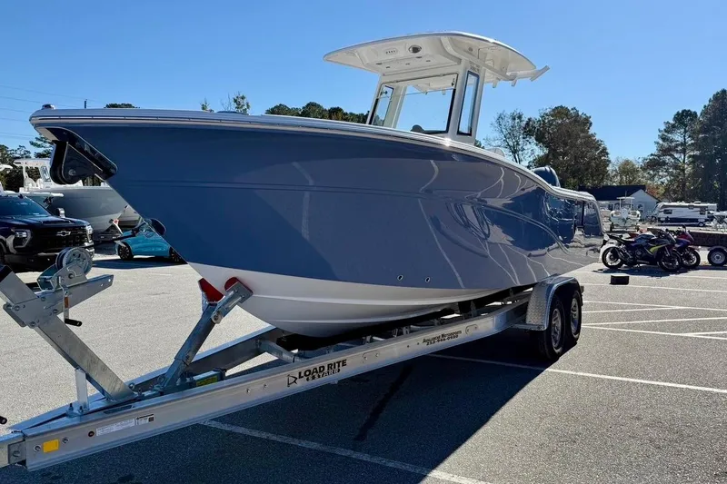 Slide: The Image of 2026 Sea Fox 268 Commander boat on trailer in parking lot, sunny day. - 5