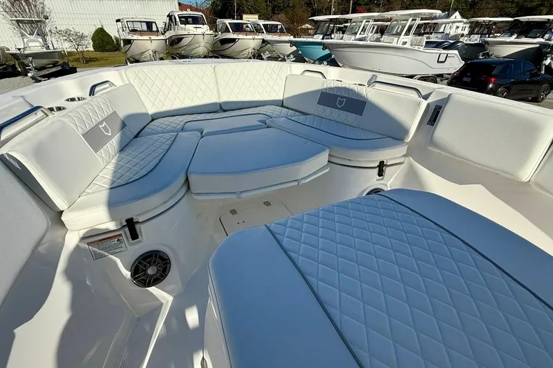 Slide: The Image of 2026 Sea Fox 268 Commander boat interior with luxurious seating and diamond-pattern upholstery. - 8