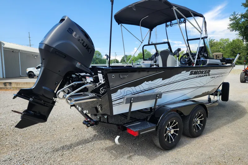 Slide: The Image of 2026 Smoker Craft Adventurer 188 DC PRO boat with Suzuki outboard motor on trailer. - 23