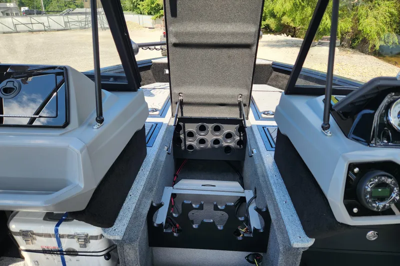 Slide: The Image of 2026 Smoker Craft Adventurer 188 DC PRO boat interior with open storage compartments. - 31