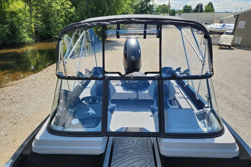 Slide: The Image of 2026 Smoker Craft Adventurer 188 DC PRO boat with clear canopy and modern interior design. - 33