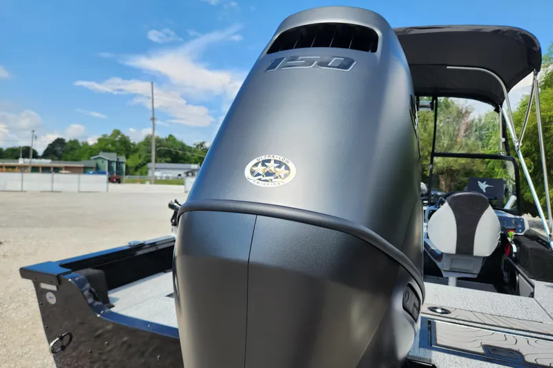 Slide: The Image of 2026 Smoker Craft Adventurer 188 DC PRO boat with powerful outboard motor, sleek design. - 38