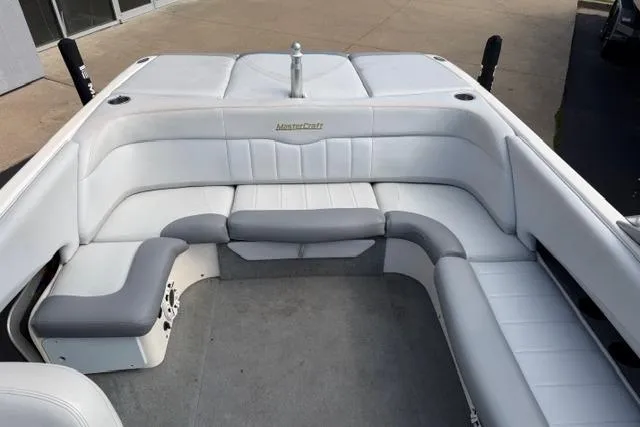 Slide: The Image of 2002 MasterCraft X30 boat interior with white and gray seating. - 13