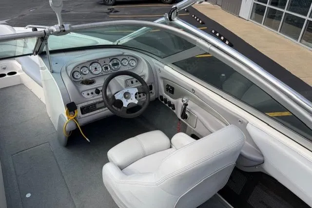 Slide: The Image of 2002 MasterCraft X30 boat interior with steering wheel and dashboard controls. - 14