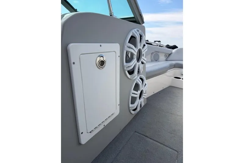 Slide: The Image of 2002 MasterCraft X30 boat interior with speakers and storage compartment. - 17