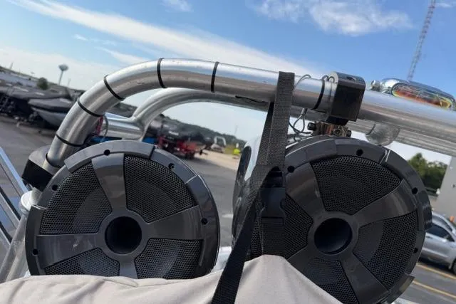 Slide: The Image of Speakers mounted on a 2002 MasterCraft X30 boat with a clear sky background. - 19