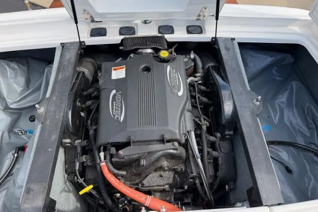 Slide: The Image of 2002 MasterCraft X30 boat engine compartment with open hatch. - 21