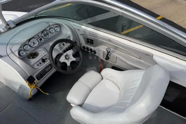 Slide: The Image of 2002 MasterCraft X30 boat interior with steering wheel and dashboard controls. - 23