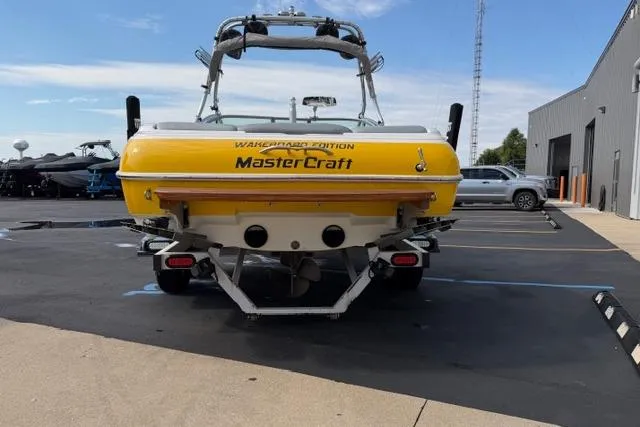 Slide: The Image of 2002 MasterCraft X30 Wakeboard Edition boat in parking lot, rear view. - 4
