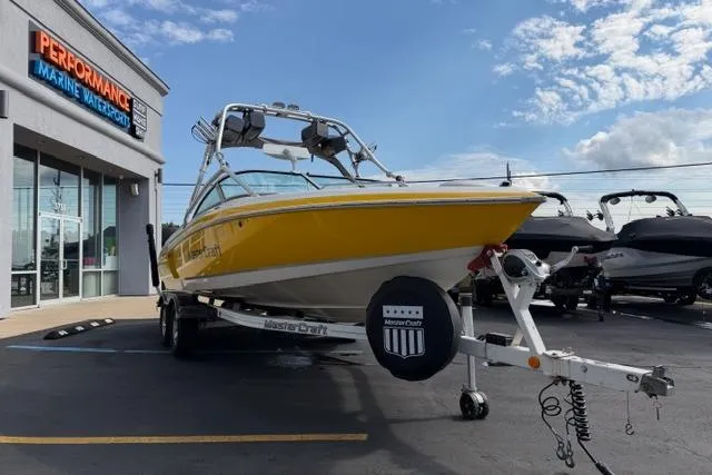 Slide: The Image of 2002 MasterCraft X30 boat in yellow on trailer at Performance Marine dealership. - 7