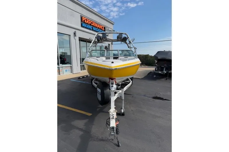 Slide: The Image of 2002 MasterCraft X30 boat in yellow on trailer at Performance Marine Watersports. - 8